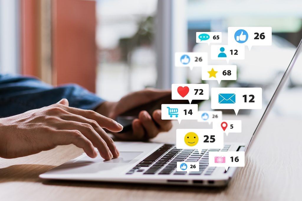 User searching and tracking down various renamed digital content types like music, movies, and webtoons on a laptop.